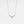 Gold necklace with blue gemstones on a light gray background
