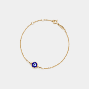A gold-plated bracelet with a solid blue enamel charm on a white background