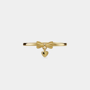 Gold bracelet with a bow and heart charm on a white background