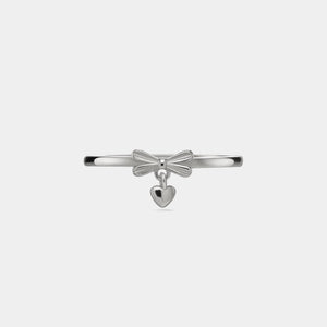 Silver bow-shaped bracelet with a heart charm on a light gray background