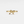 Gold bow-shaped ring on a white background