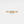 Gold ring with bow design on a light gray background