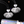 Silver floral earrings on a black background