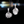 Pair of silver floral earrings on a dark background