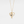 Gold necklace with a heart-shaped pendant featuring a gray gemstone on a light gray background