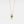 Gold necklace with a blue gemstone pendant on a white background