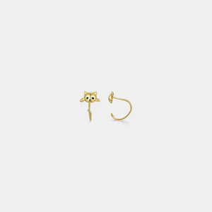 Gold cat-shaped earring on a white background