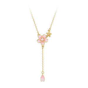 Necklace with a pink flower pendant on a white background