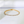 Gold bracelet with diamonds on a white background