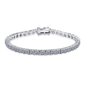 Silver bracelet with clear stones on a white background