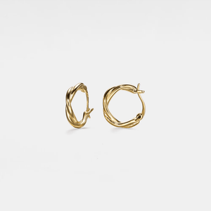 A pair of gold-plated twisted rope hoop earrings on a white background