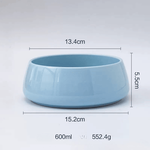 Blue ceramic bowl with measurements on a white background