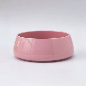 Pink ceramic bowl on a white background