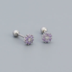 A collection of stud earrings with flower designs, featuring various colors and with gold plating.