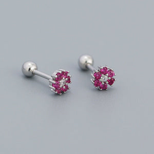 A collection of stud earrings with flower designs, featuring various colors and with gold plating.
