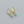 Gold hoop earrings with turquoise stones on a gray background