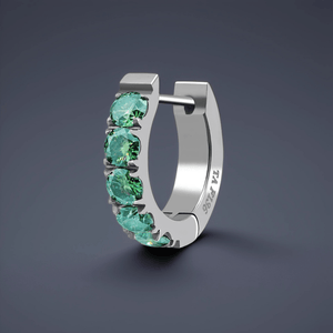Silver hoop earring with green gemstones on a dark gray background