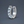 Silver hoop earring with clear gemstones on a dark gray background