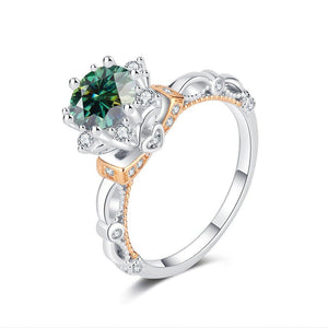 A sterling silver moissanite cocktail ring with a flower design, featuring a central moissanite gemstone surrounded by smaller ones, set on a white background.