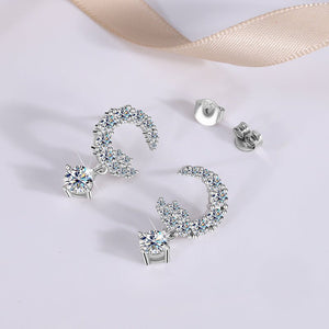 Silver earrings with gemstones on a light background