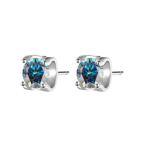 A pair of silver four-prong moissanite stud earrings with a hypoallergenic finish.
