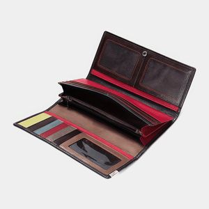 Open leather wallet with multiple card slots on a light gray background