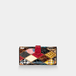 Multicolored patchwork clutch bag on a light gray background