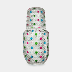 Decorative vase with colorful polka dot pattern on a white background