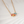Necklace with colorful gemstones on a light background