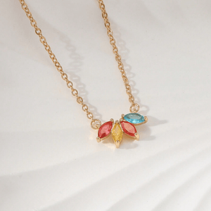 Necklace with colorful gemstones on a light background