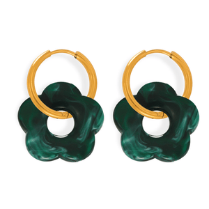 Pair of earrings with green floral designs and gold hoop accents on a white background