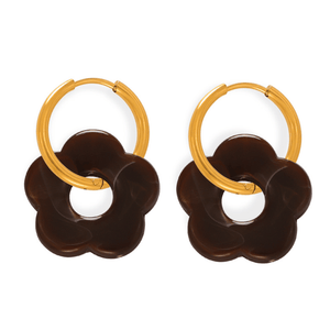 Pair of earrings with gold hoop and brown flower-like design on a white background