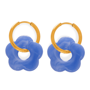 Pair of hoop earrings with blue floral designs and gold loops on a white background
