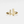 Gold ring with horizontal and vertical bars on a light gray background