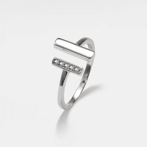 A gold-plated sterling silver ring with a hypoallergenic finish, featuring a central cubic zirconia stone surrounded by two smaller stones, displayed on a plain background.