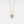 Rose gold necklace with a circular pendant featuring a blue gemstone on a light gray background