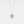 Silver necklace with a circular pendant featuring a blue gemstone on a light gray background