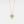 Gold necklace with a star-shaped pendant on a light gray background