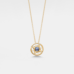 Gold necklace with a star-shaped pendant on a light gray background