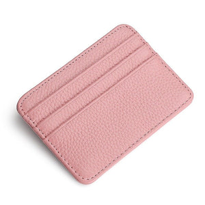 Pink leather cardholder on a white background