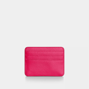 Pink textured cardholder on a light gray background