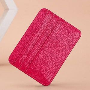 Red textured wallet on a beige background