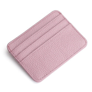 Pink leather cardholder on a white background