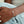 Bracelet with colorful beads on a wrist against a blurred background