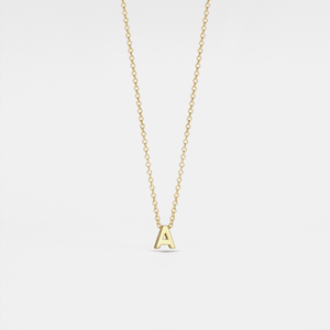 Gold necklace with a 'A' pendant on a light gray background