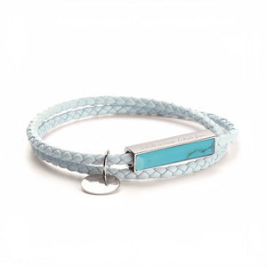 Light blue braided leather bracelet with a turquoise stone and silver tag on a white background