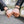 Two pairs of hands holding each other with blurred background