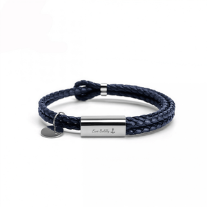 Navy braided leather bracelet with silver tag on a white background