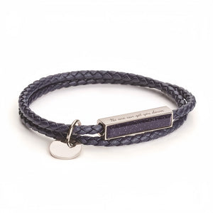 Navy braided leather bracelet with a silver tag on a white background