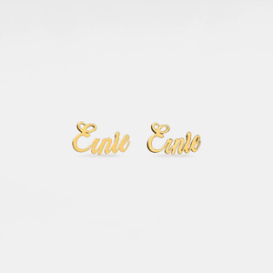 Gold 'Einie' earrings on a light gray background